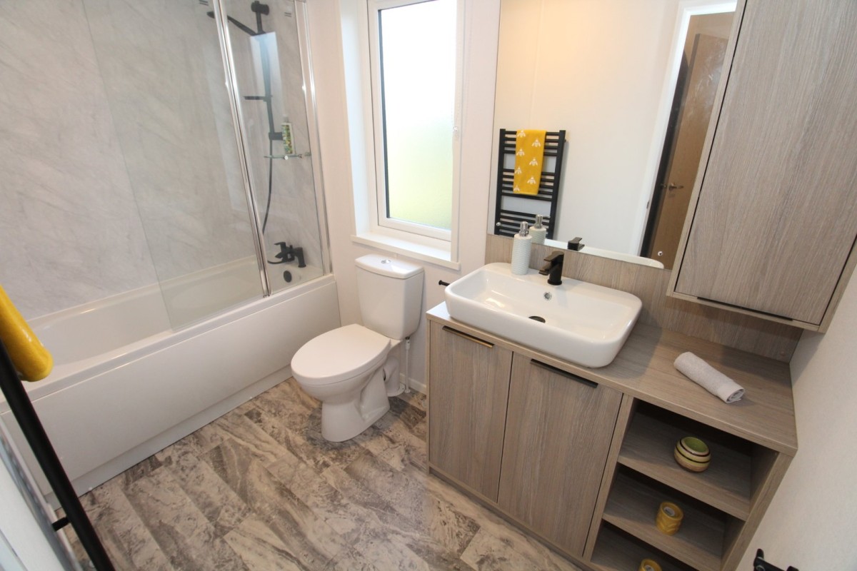 bathroom with full size bath in the2023 Atlas Lilac Lodge