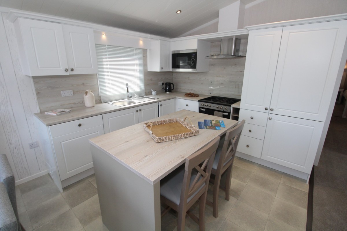 kitchen with breakfast bar in the 2023 Swift Edmonton Lodge