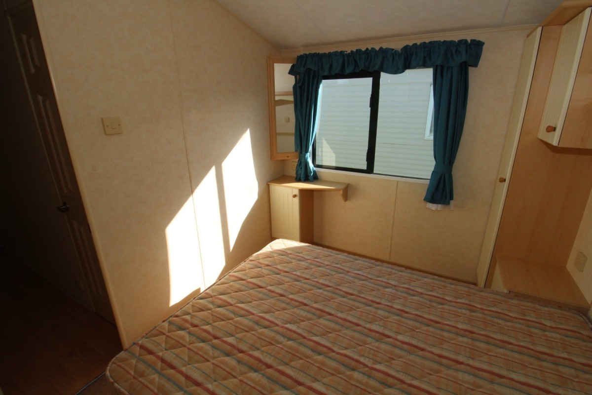 double bed by windows in the 2007 Willerby Richmond