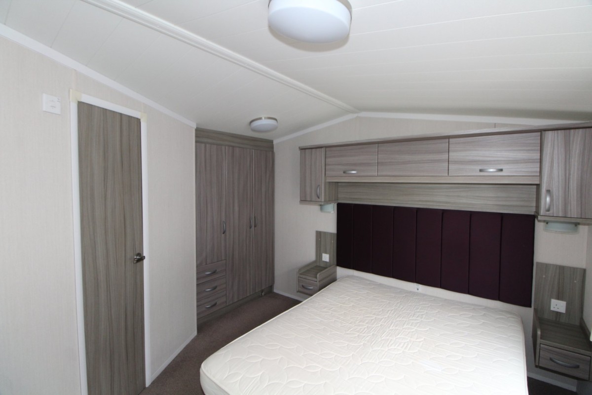 double bed with large headboard in the 2015 Swift Moselle