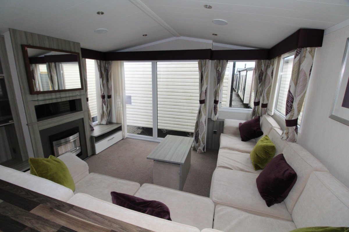 lounge with large front doors in the 2015 Swift Moselle