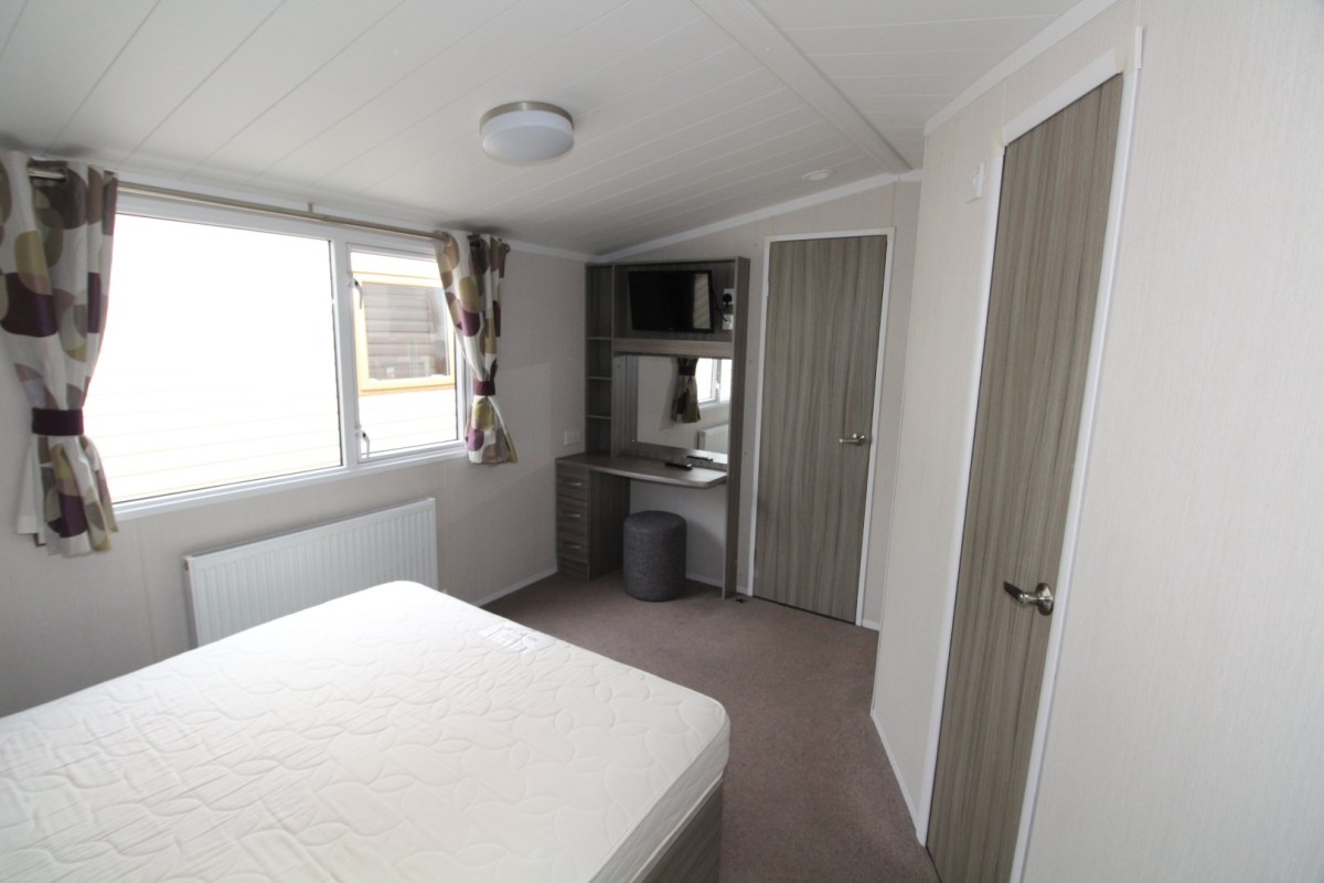 double bedroom with dressing table in the 2015 Swift Moselle