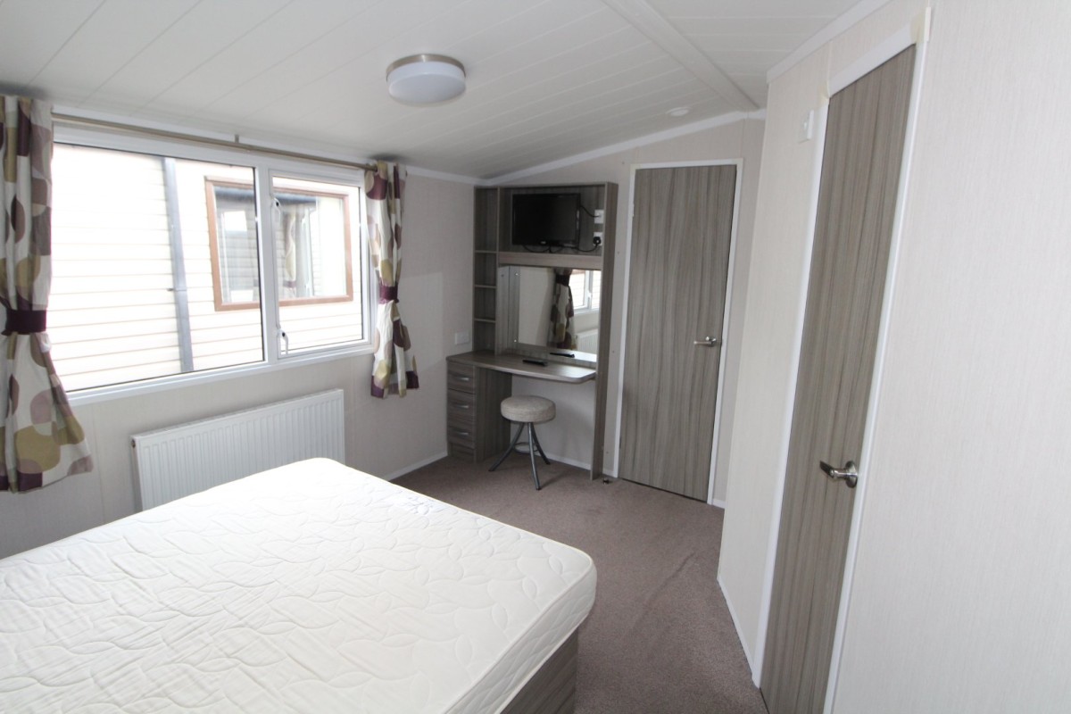 double bedroom with dressing table in the 2015 Swift Moselle