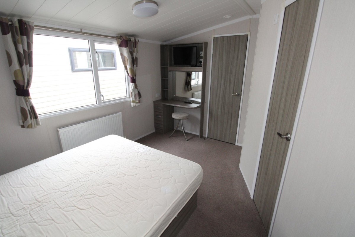 double bedroom with dressing table in the 2015 Swift Moselle