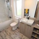 bathroom with full size bath in the2023 Atlas Lilac Lodge