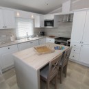 kitchen with breakfast bar in the 2023 Swift Edmonton Lodge