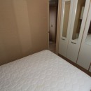 double bedroom with wardrobes in the 2010 Willerby Granada