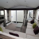 lounge with large front doors in the 2015 Swift Moselle