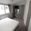 double bedroom with dressing table in the 2015 Swift Moselle