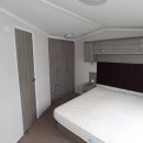 double bedroom with large headboard in the 2015 Swift Moselle